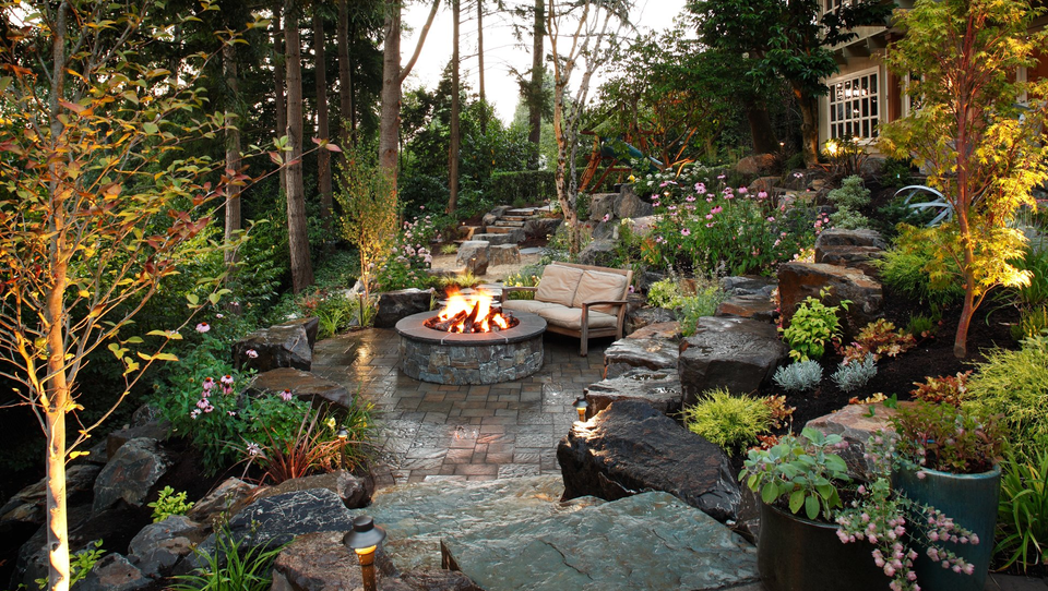 Fireplace and patio with greenery