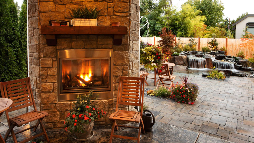 fire place and water feature in backyard