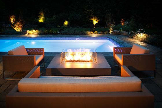 pool side fireplace backyard