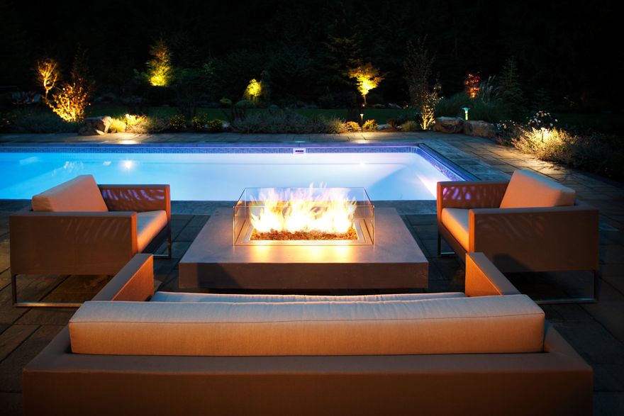 night lighting outdoor resort pool and fire pit