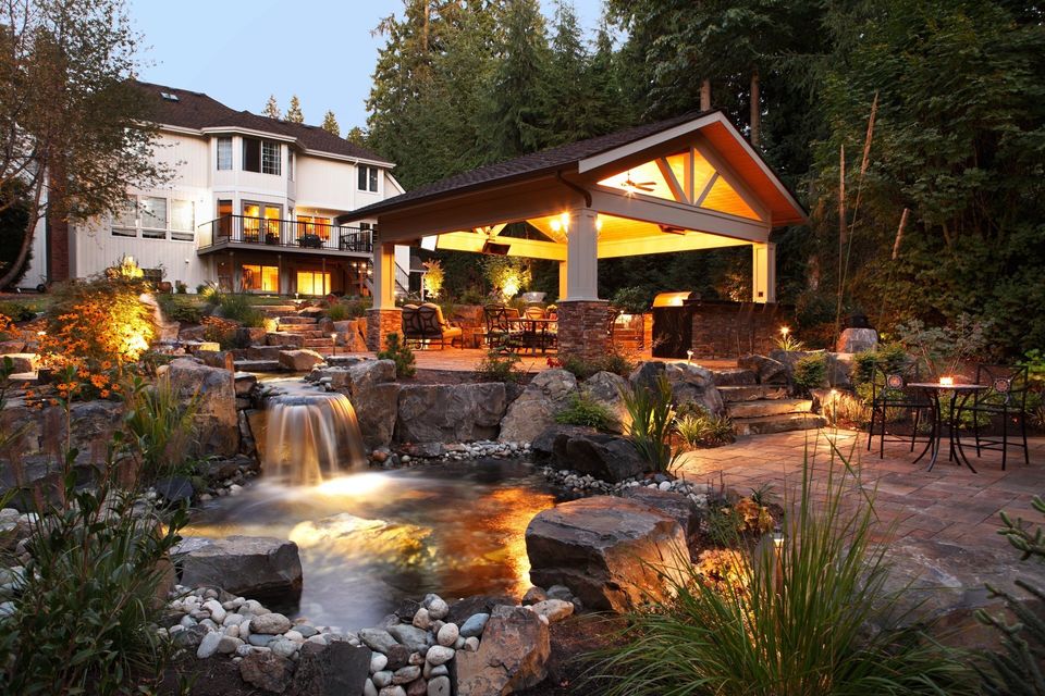 outdoor living water feature and outdoor kitchen