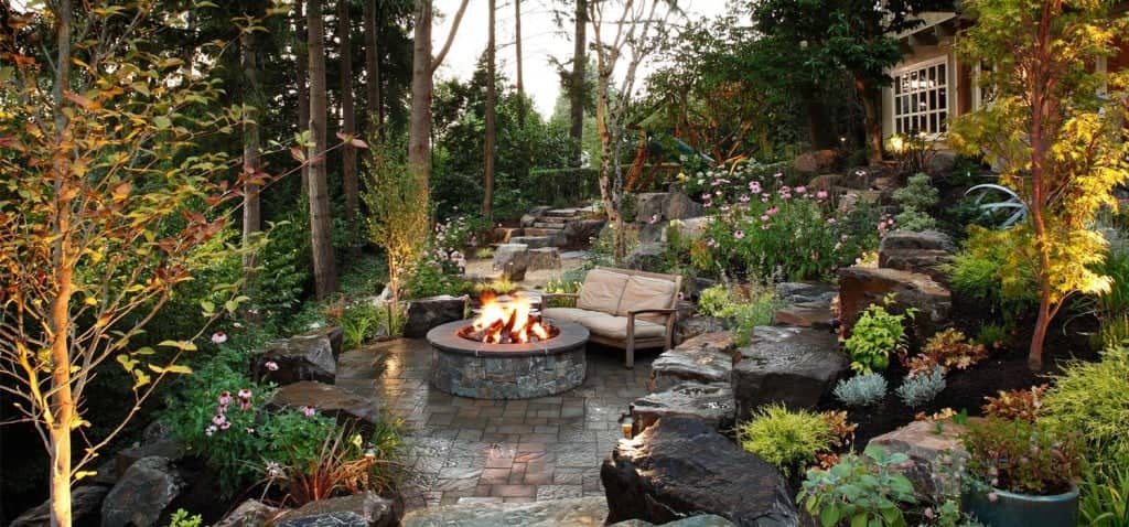 backyard paver patio fireplace seating area