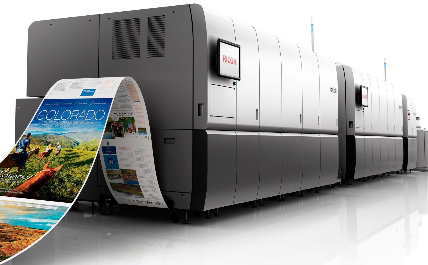 a large printing machine is printing a picture of a landscape .