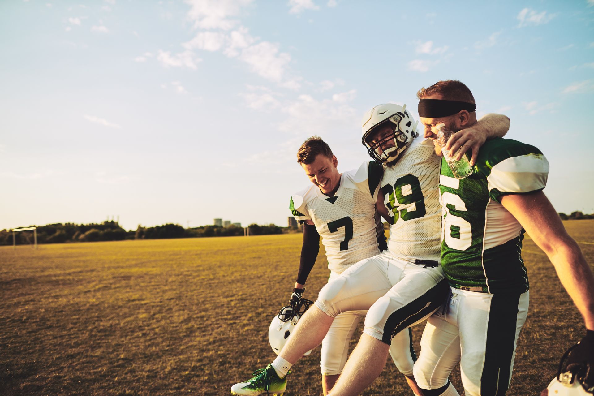 Football player being carried off the field with a turf toe injury