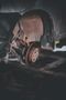 A close up of a car wheel with a rusty brake disc.