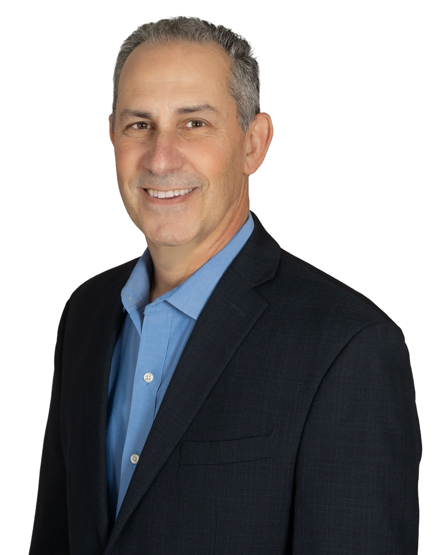 Man in blue shirt and navy blazer smiling at the camera.
