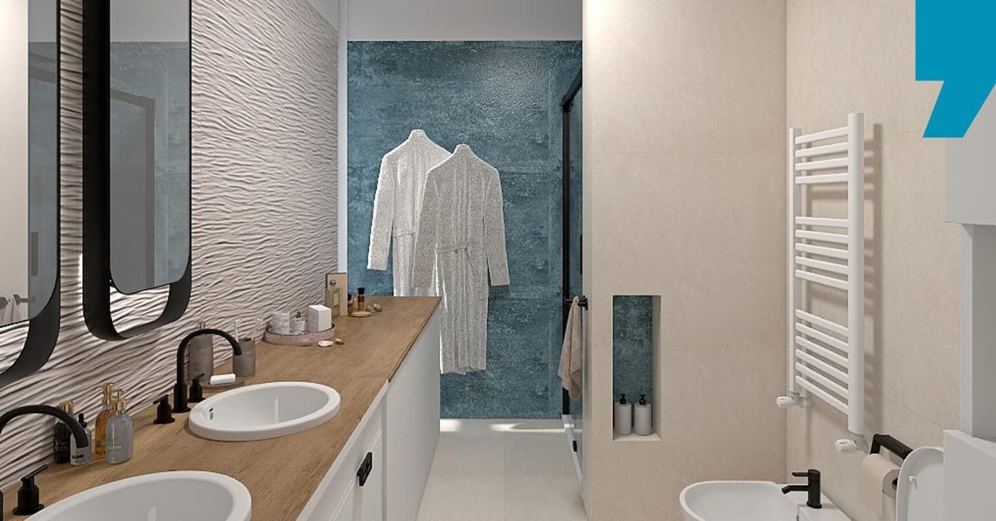 Bagno moderno con doppio lavabo, mobiletto in legno, asciugamani bianchi e cabina doccia in vetro con parete decorata con piastrelle blu.
