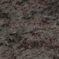 A close-up of a textured stone surface with mottled patterns in shades of gray, black, and reddish-brown.