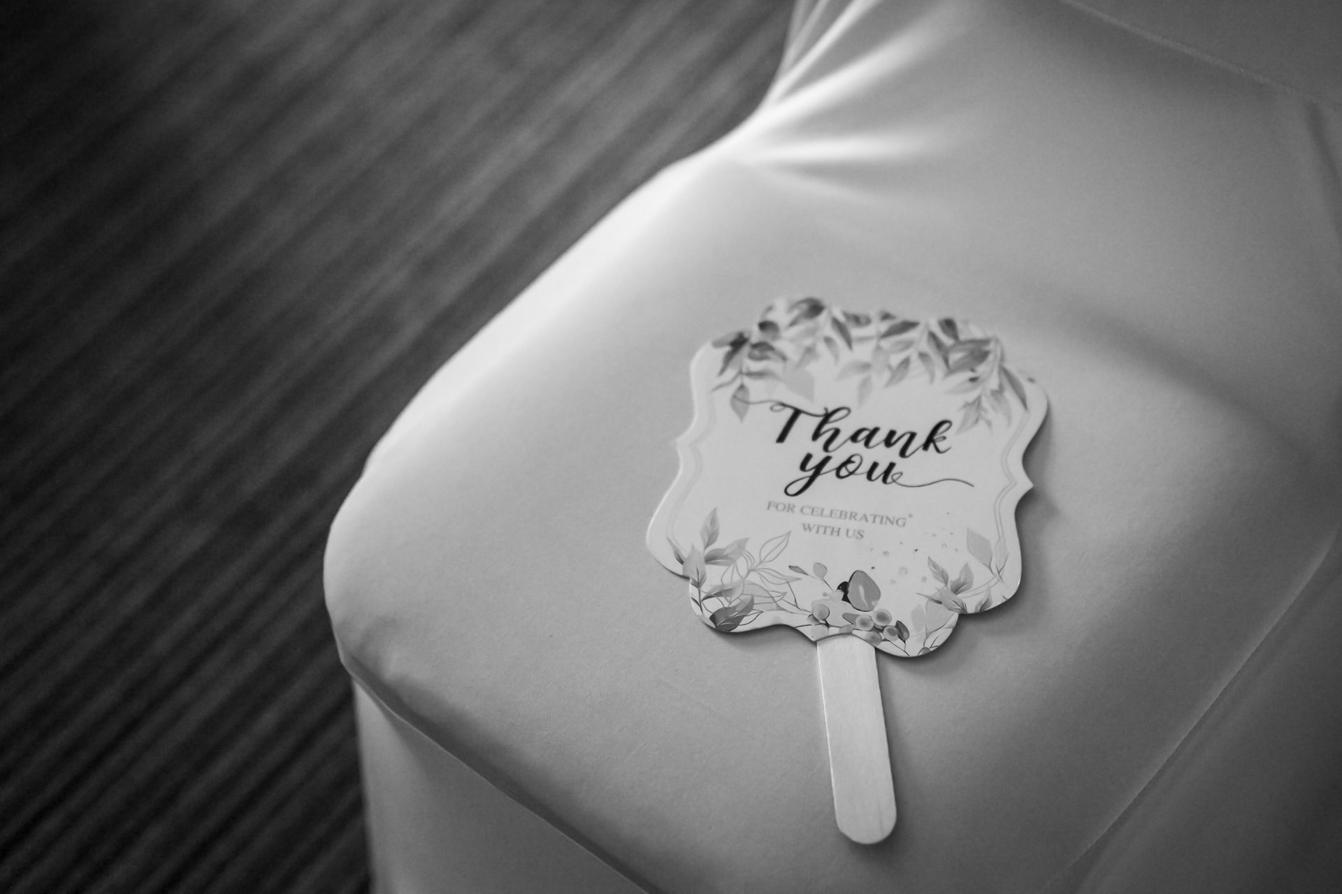 A wedding favor fan with 