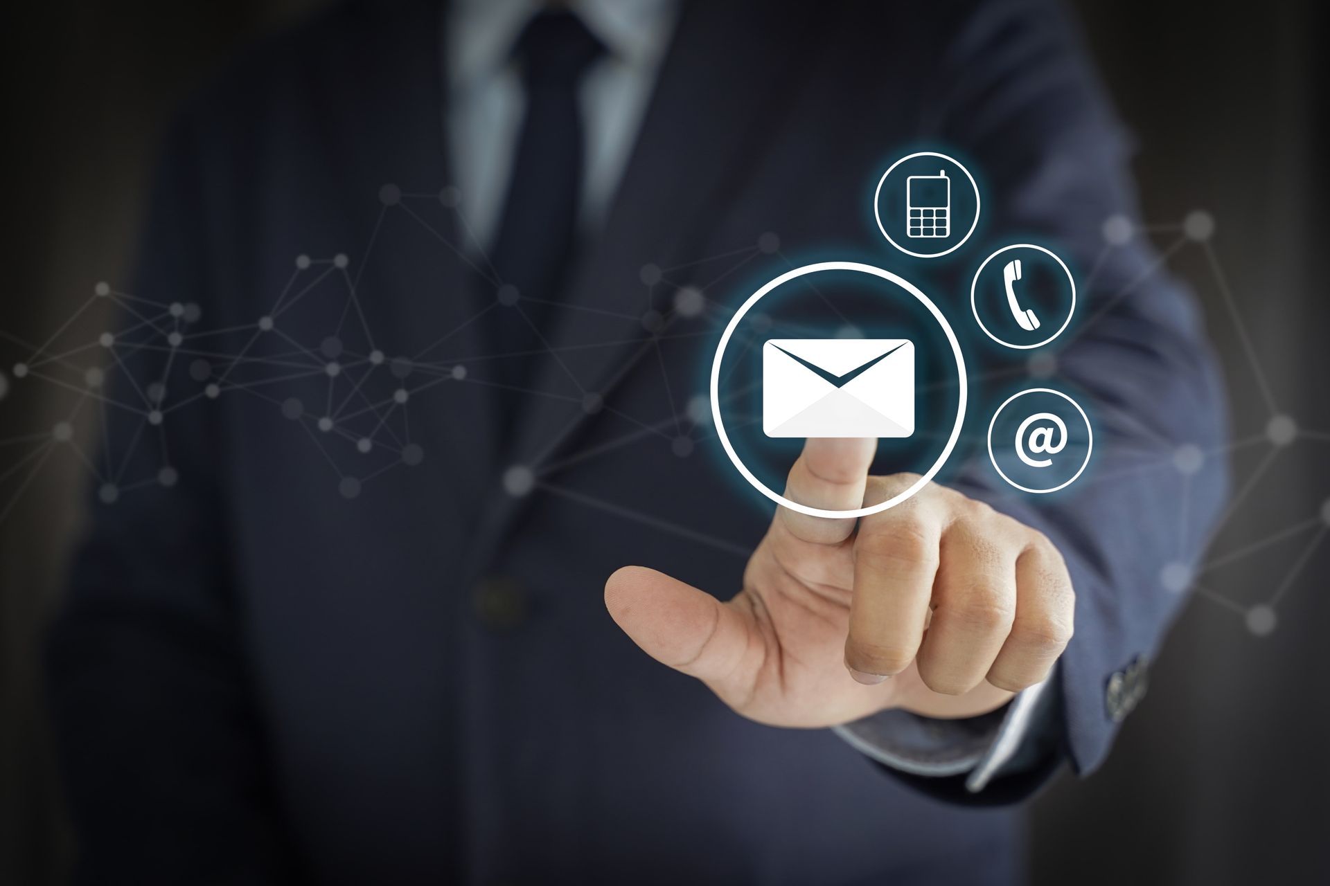 Person in suit touching an email icon in a virtual network.