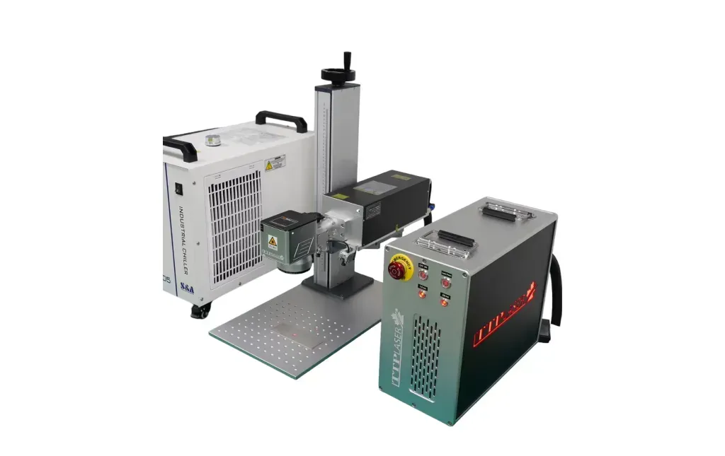 A laser marking machine set up on a metal plate. Includes three units in gray and black.
