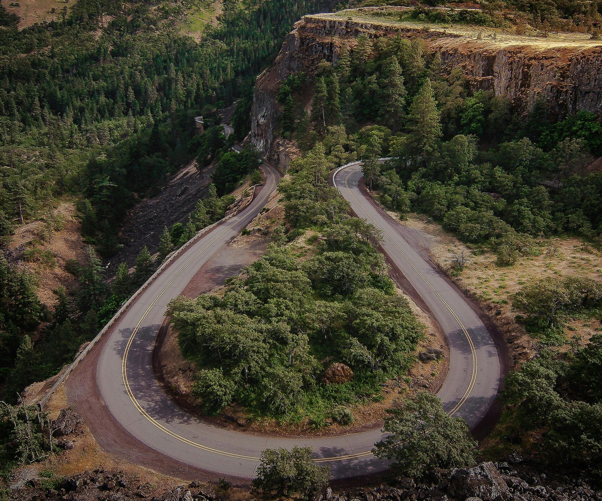 Overhead view of a winding road through the roods in Oregon