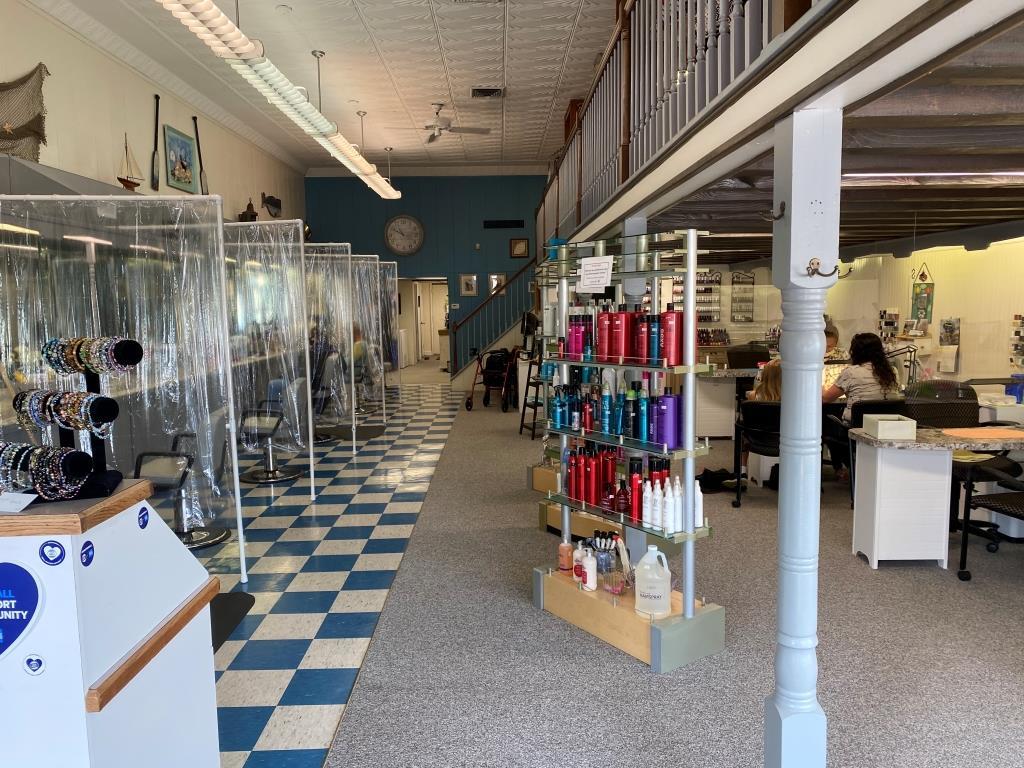 The inside of a hair salon with a checkered floor
