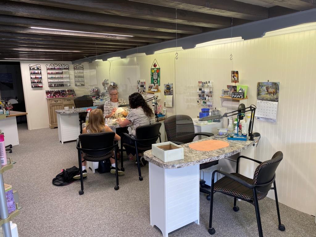 A group of people are sitting at a table in a room.