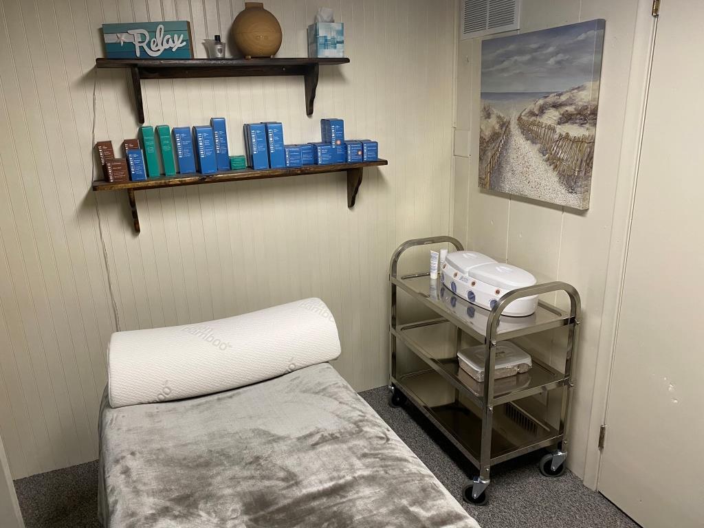 A room with a bed, shelves, and a sign that says relax
