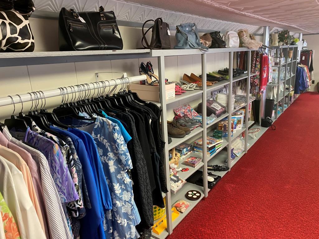 A row of clothes hanging on a rack in a store