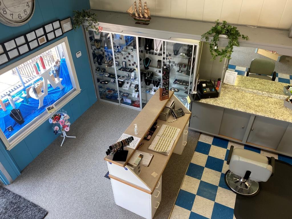 An aerial view of a barber shop with a checkered floor
