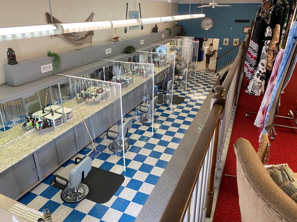 A barber shop with a blue and white checkered floor