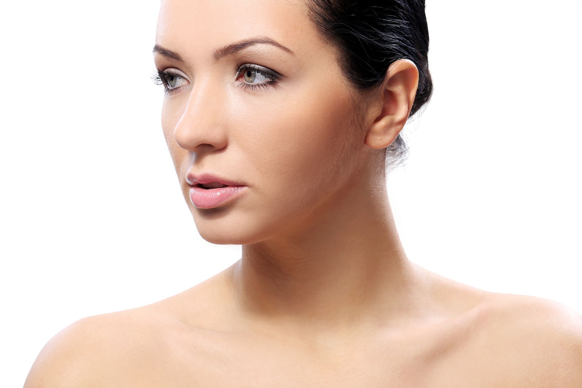 A close up of a woman 's face and neck on a white background.