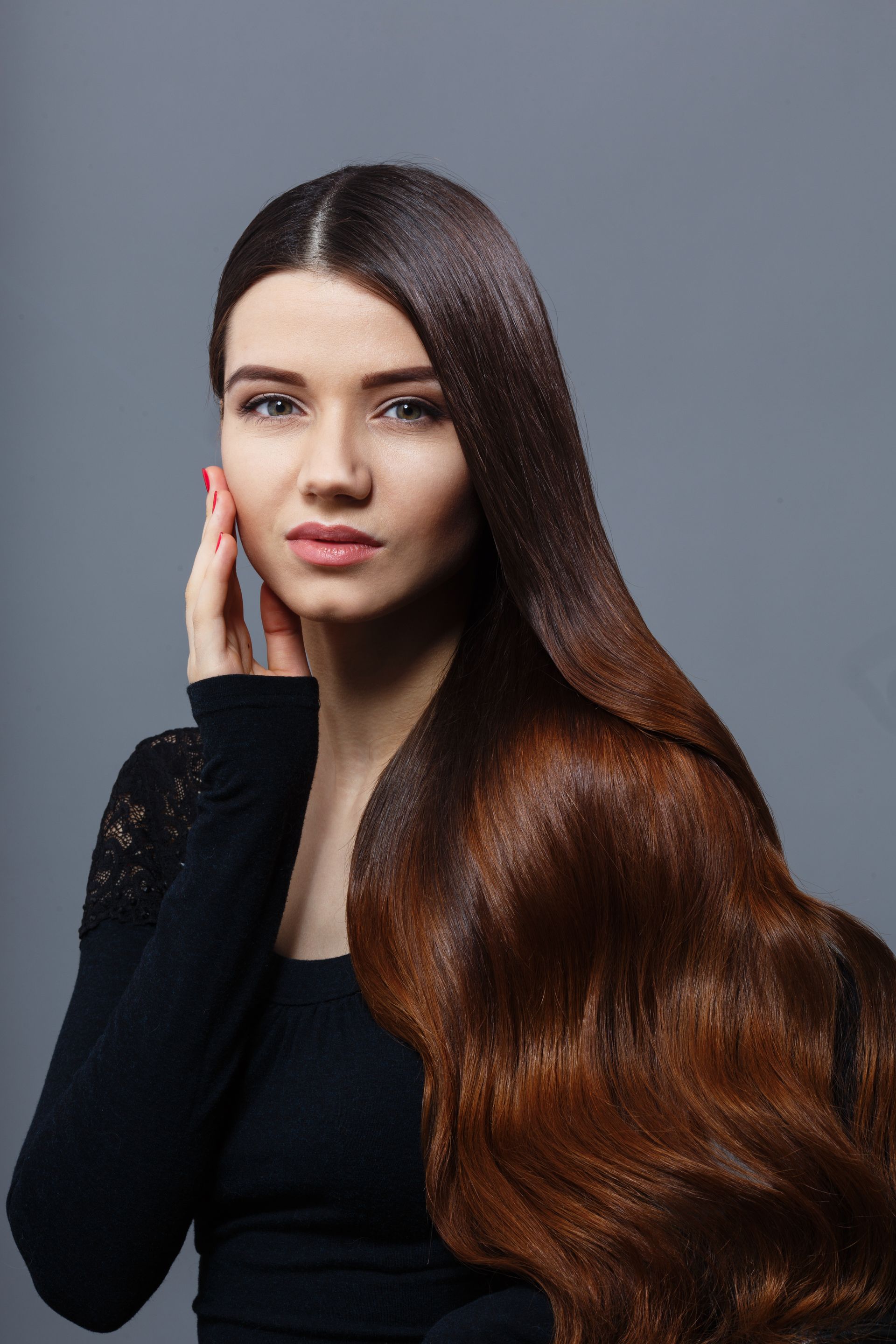 a woman touching her face