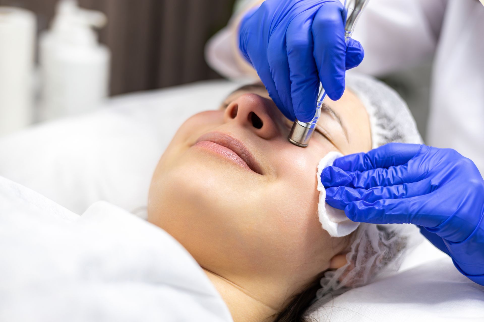 A woman is getting a facial treatment in a beauty salon.