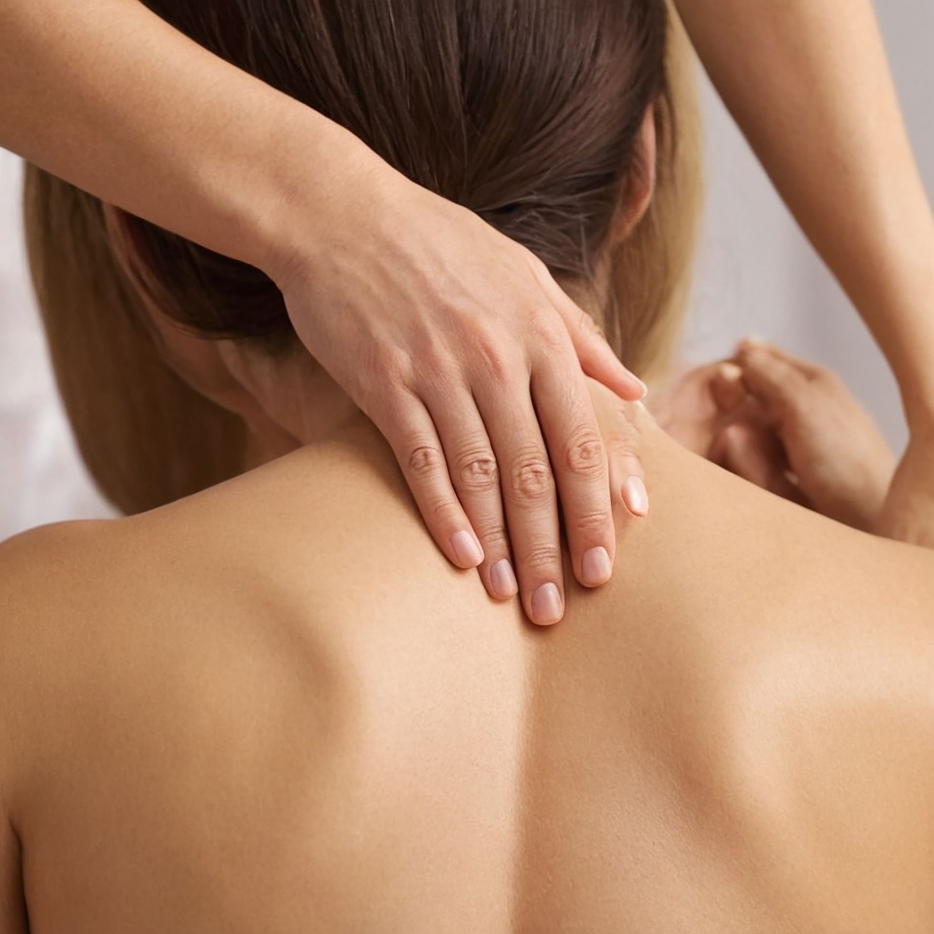 A woman is getting a massage on her back