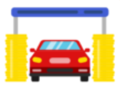 A red car is going through a car wash.