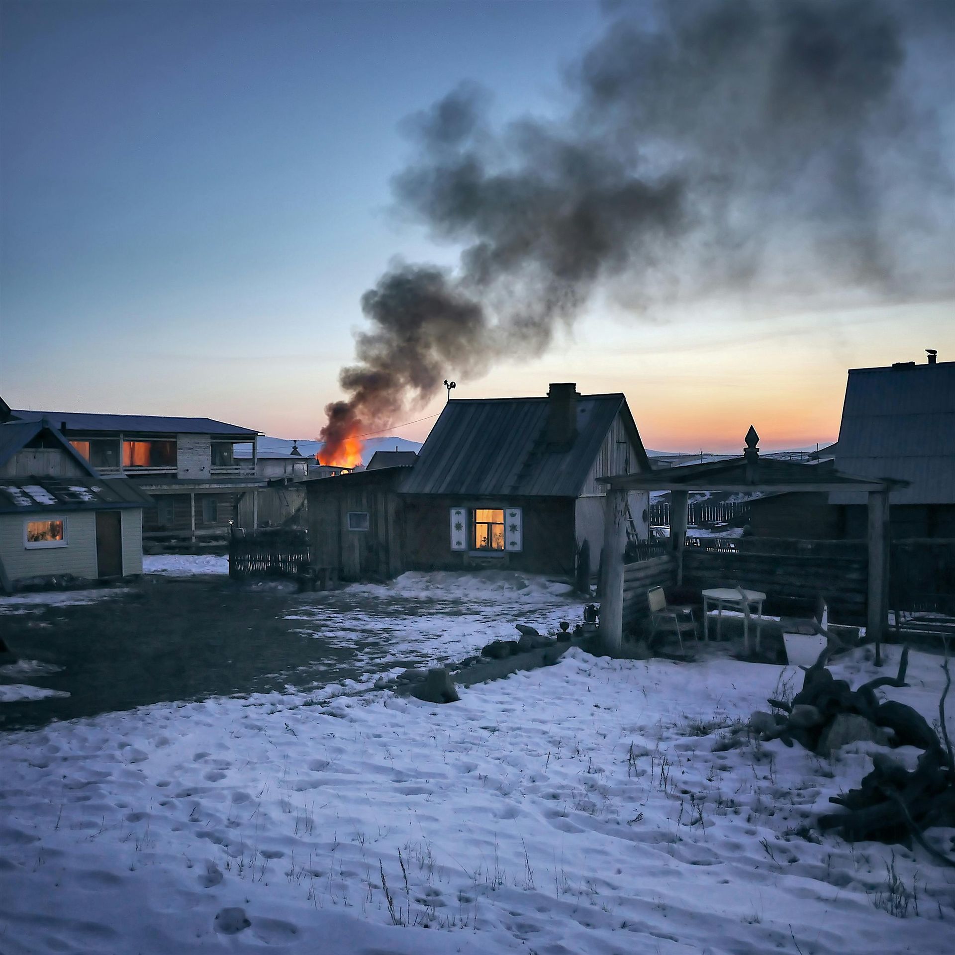 Smoke is coming out of the chimney of a house