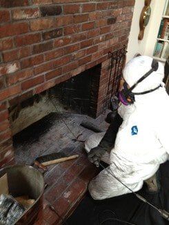 Employee Cleaning Fireplace - Chimney Cleaning Services in Norwood, MA