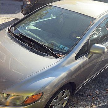 Silver Honda Civic car parked outdoors.