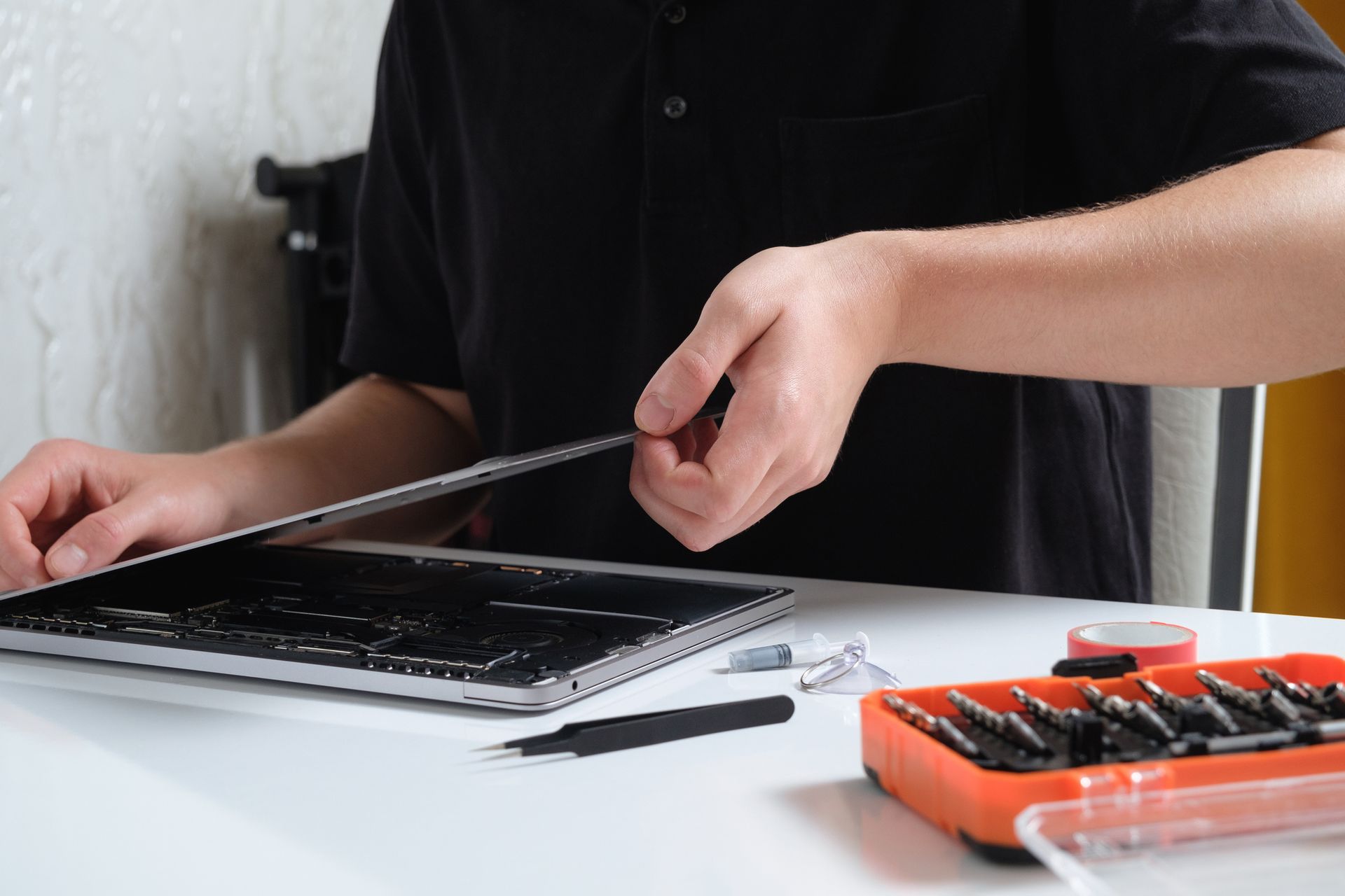 Technician working on MacBook repair