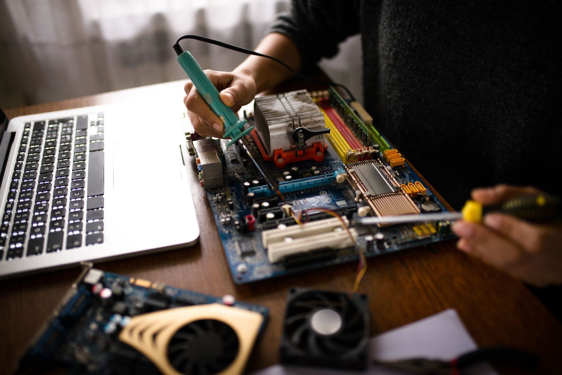 Close up of a woman hands repairing computer | Always Apples | Sydney 