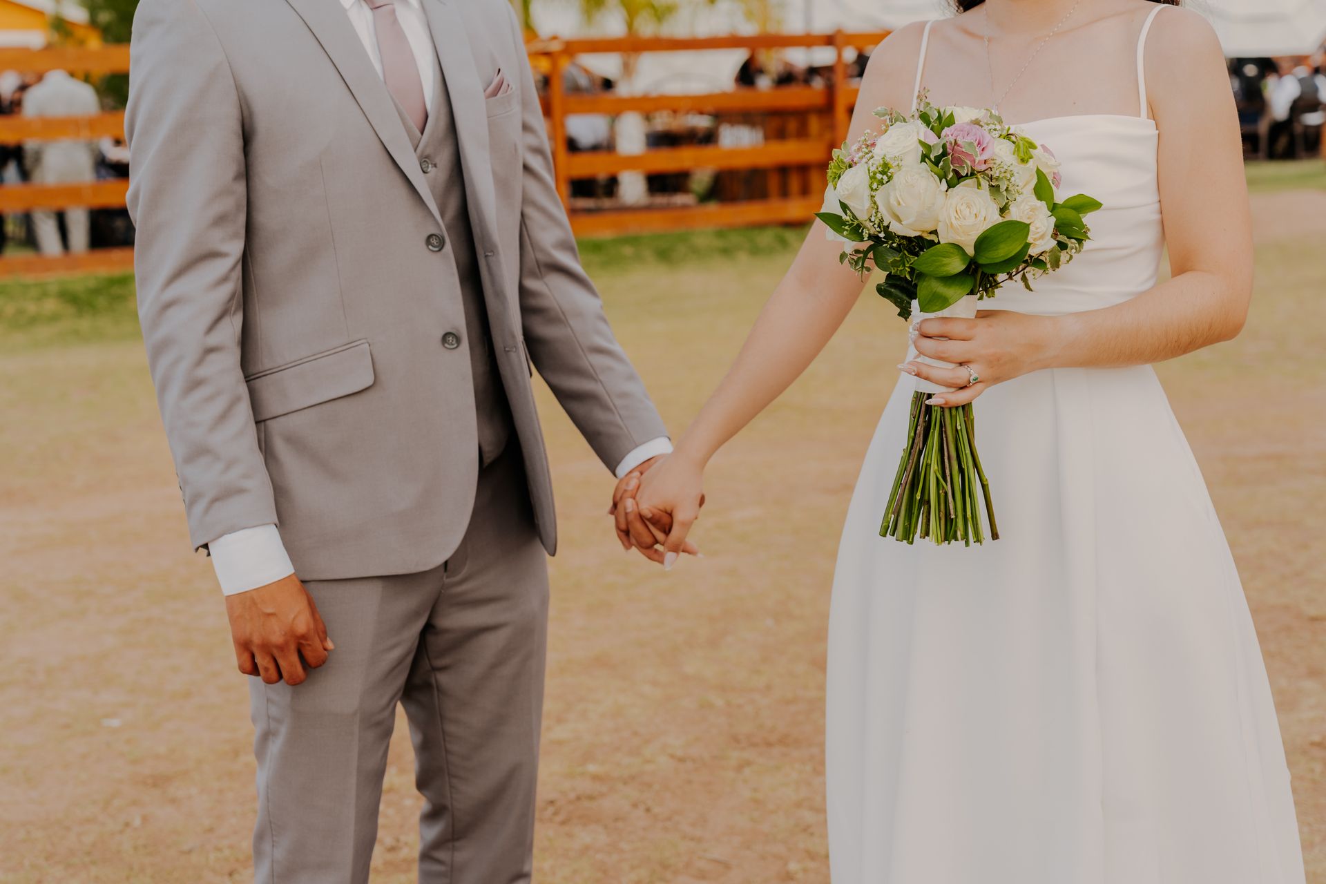 A man and a woman are standing next to each other wearing cowboy hats and sunglasses.