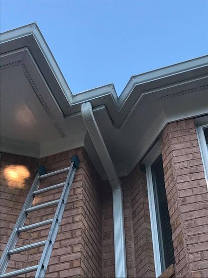 Man Repairing Gutter — Virginia Beach, VA — Lines Seamless Gutter, Inc.