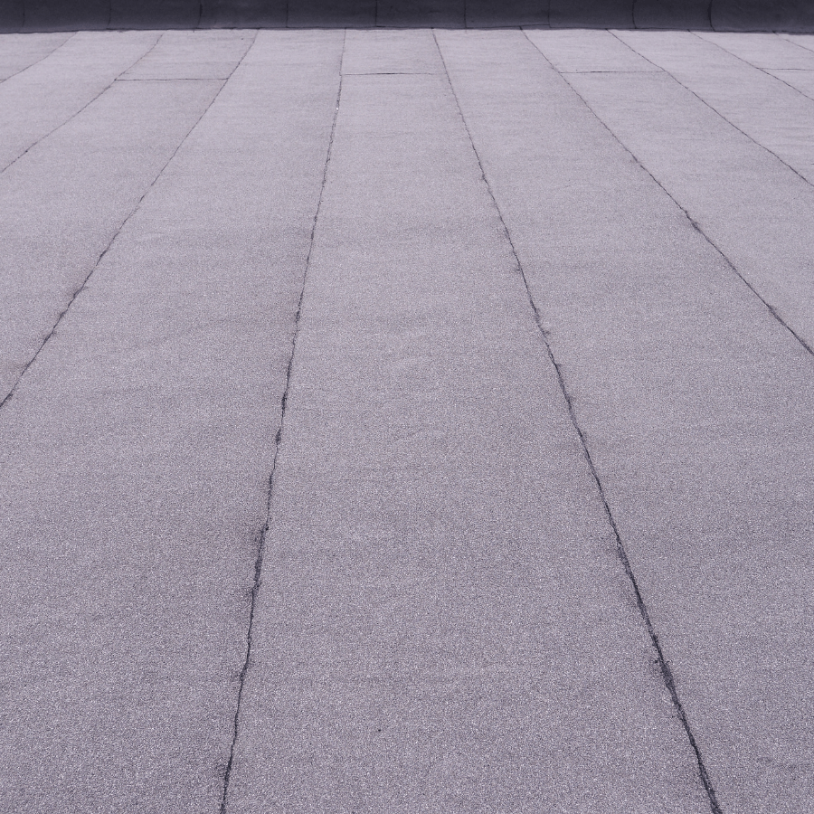 En närbild av ett grått betonggolv med ett diagonalt mönster.