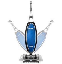 A blue and black vacuum cleaner is sitting on top of a white surface.