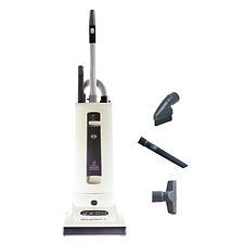 A white vacuum cleaner with attachments on a white background.
