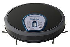 A robot vacuum cleaner is sitting on a white surface.