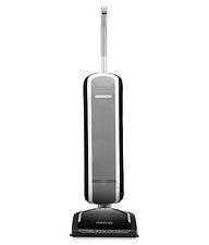 A vacuum cleaner is sitting on a white surface.