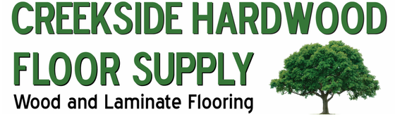 Logo for Creekside Hardwood Floor Supply featuring green text and a small tree graphic.