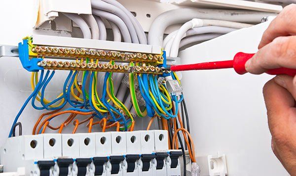 Electrician — Electrical Contractor Fixing Wire Connection in Mobile, Alabama
