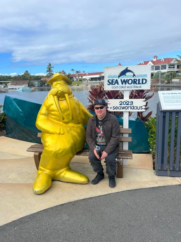 Man Taking Picture With Golden Sea Lion  — Ballarat, VIC — West End Support Services