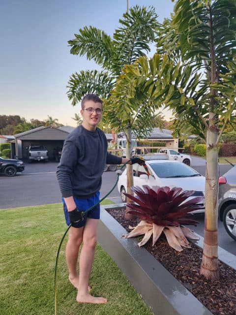 Young Man Holding Power Washer — Ballarat, VIC — West End Support Services