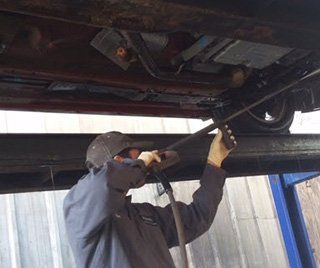 Auto Care Fixing — Mechanic Working On A Diesel Filter in Spring Valley, CA