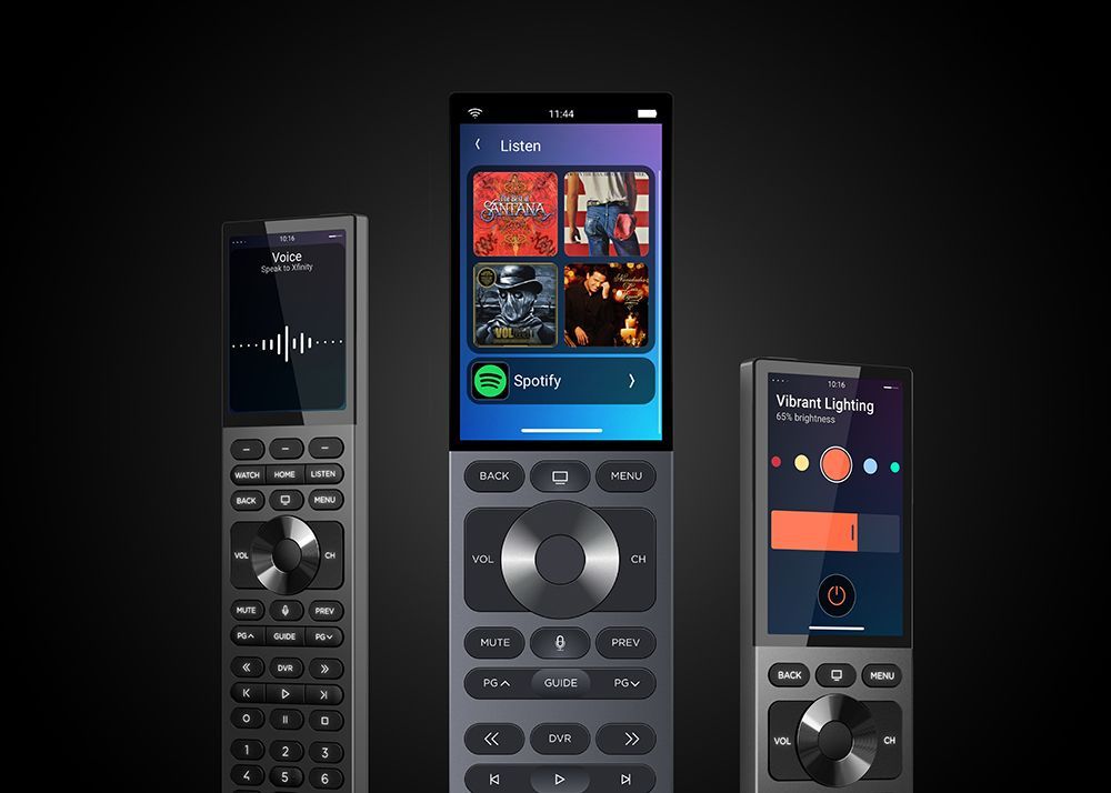 Three remote controls are sitting next to each other on a black background.