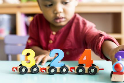Two Year Old Girl Stacking Bricks — Philadelphia, PA — Learning World Child Academy