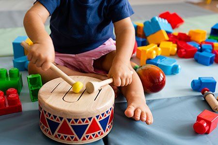 Toddler Playing Drums — Philadelphia, PA — Learning World Child Academy