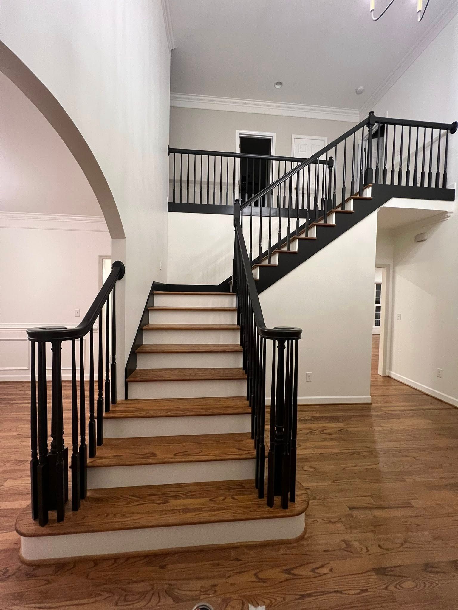 A person in a white apron is working in a kitchen