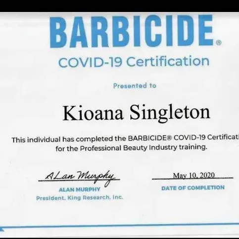 A certificate that says barbicide covid-19 certification