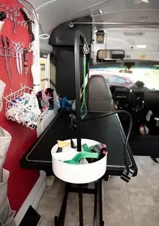 The inside of a bus with a table and a mirror